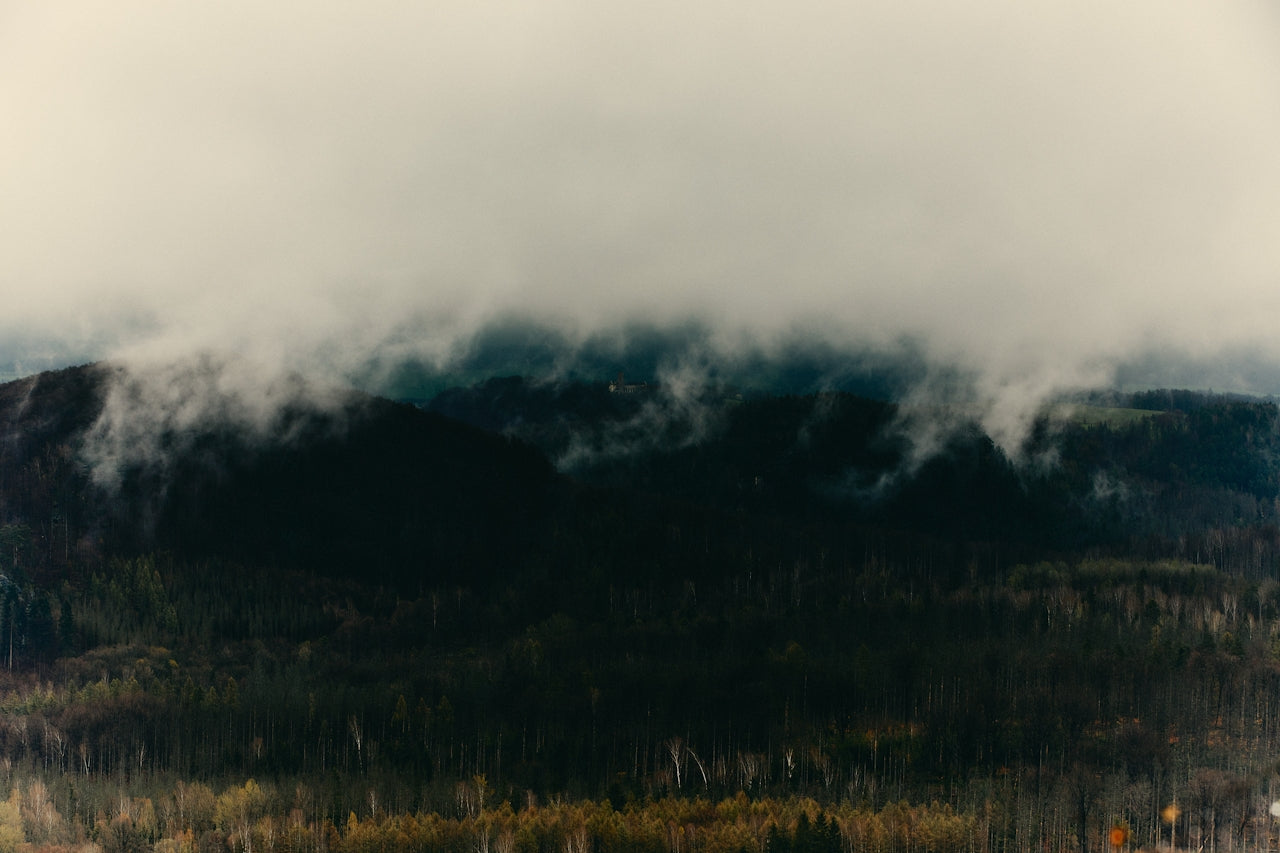 Mountain landscape with clouds rolling over the peaks